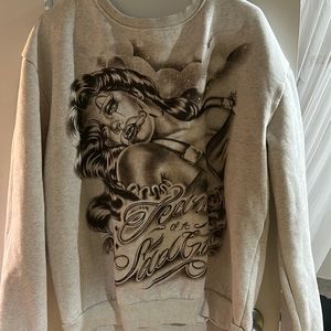 This is a new sweater it’s only been worn once. It’s a light gray sweater